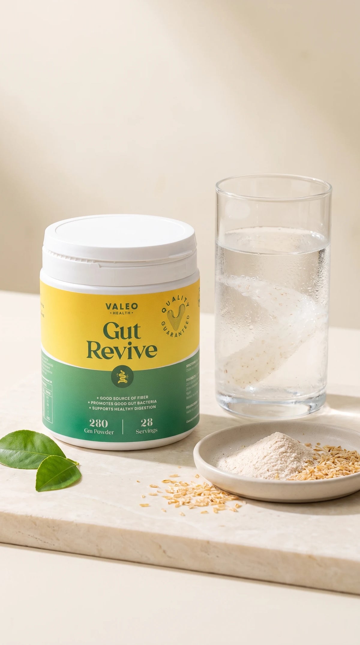 Valeo Gut Revive 280g jar beside a glass of mixed fibre drink and a dish of psyllium powder